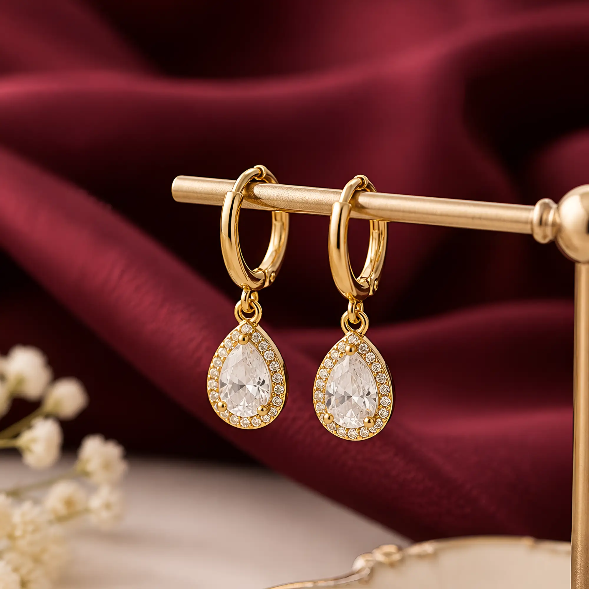 Gold Teardrop Crystal Halo Earrings on themed bg